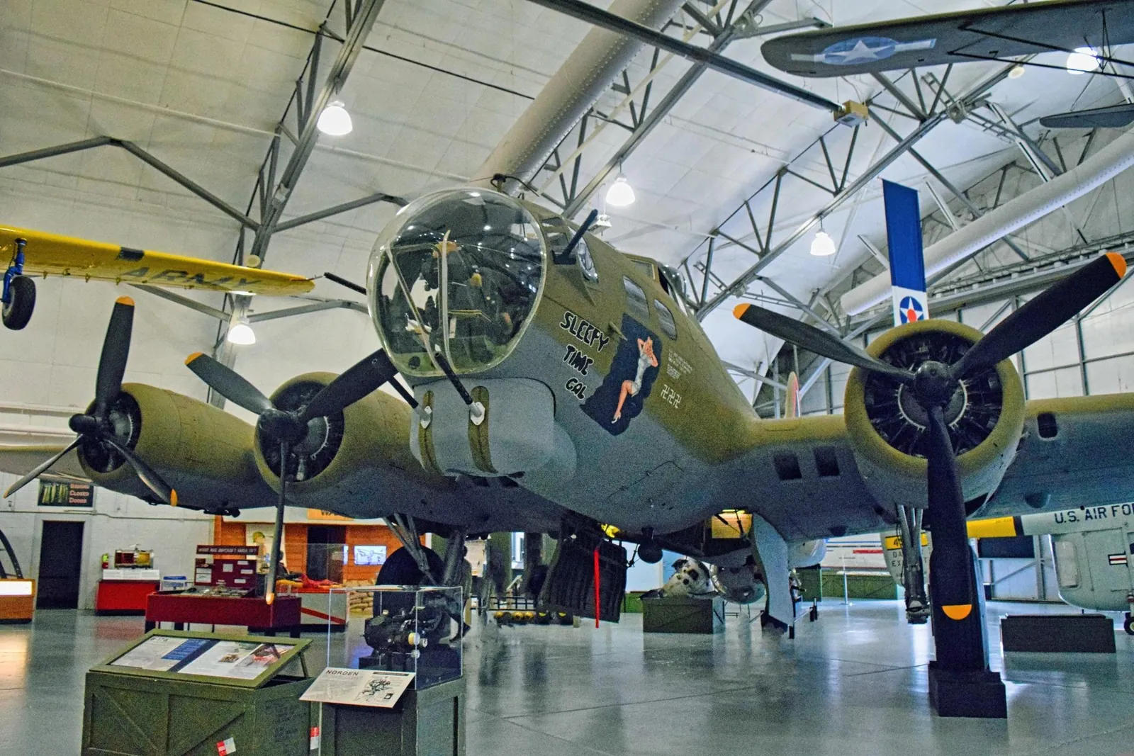 A World War II bomber displayed beneath the Museum of Flight's arched hangar roof