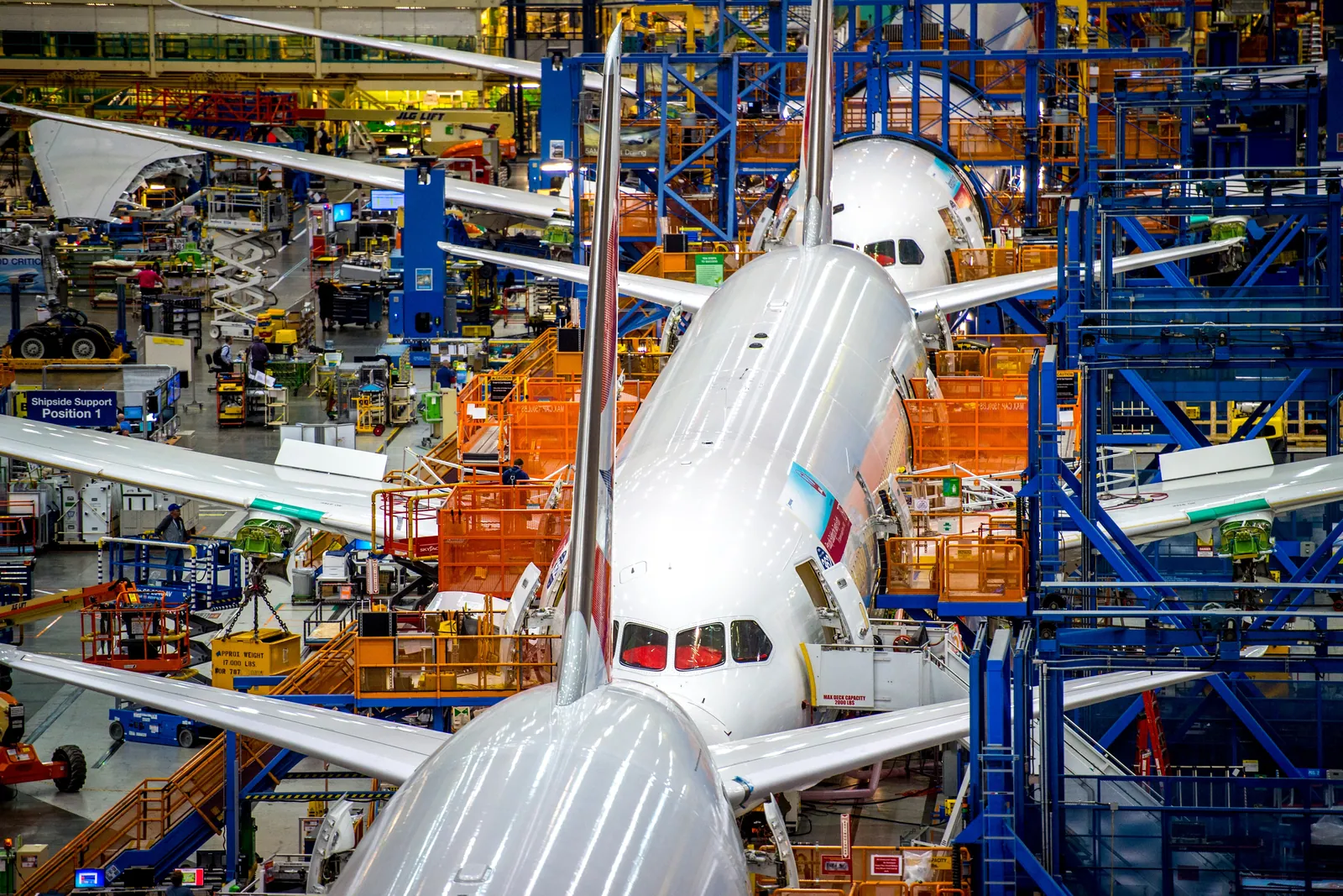 Dreamliner tail fins lined up along the Everett final assembly line